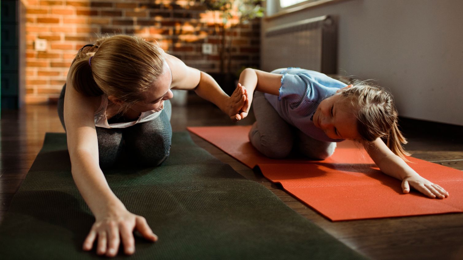 Mom does yoga with daughter